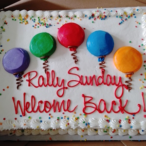 Rally Sunday cake with coloured balloons