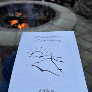 Easter Sunrise Service program beside fire pit